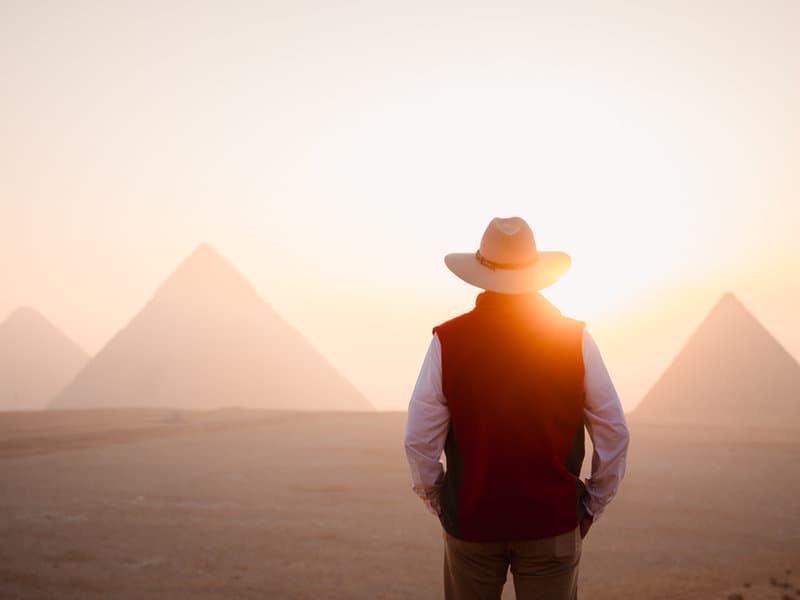 Mo watching the sunrise over the pyramids of Giza